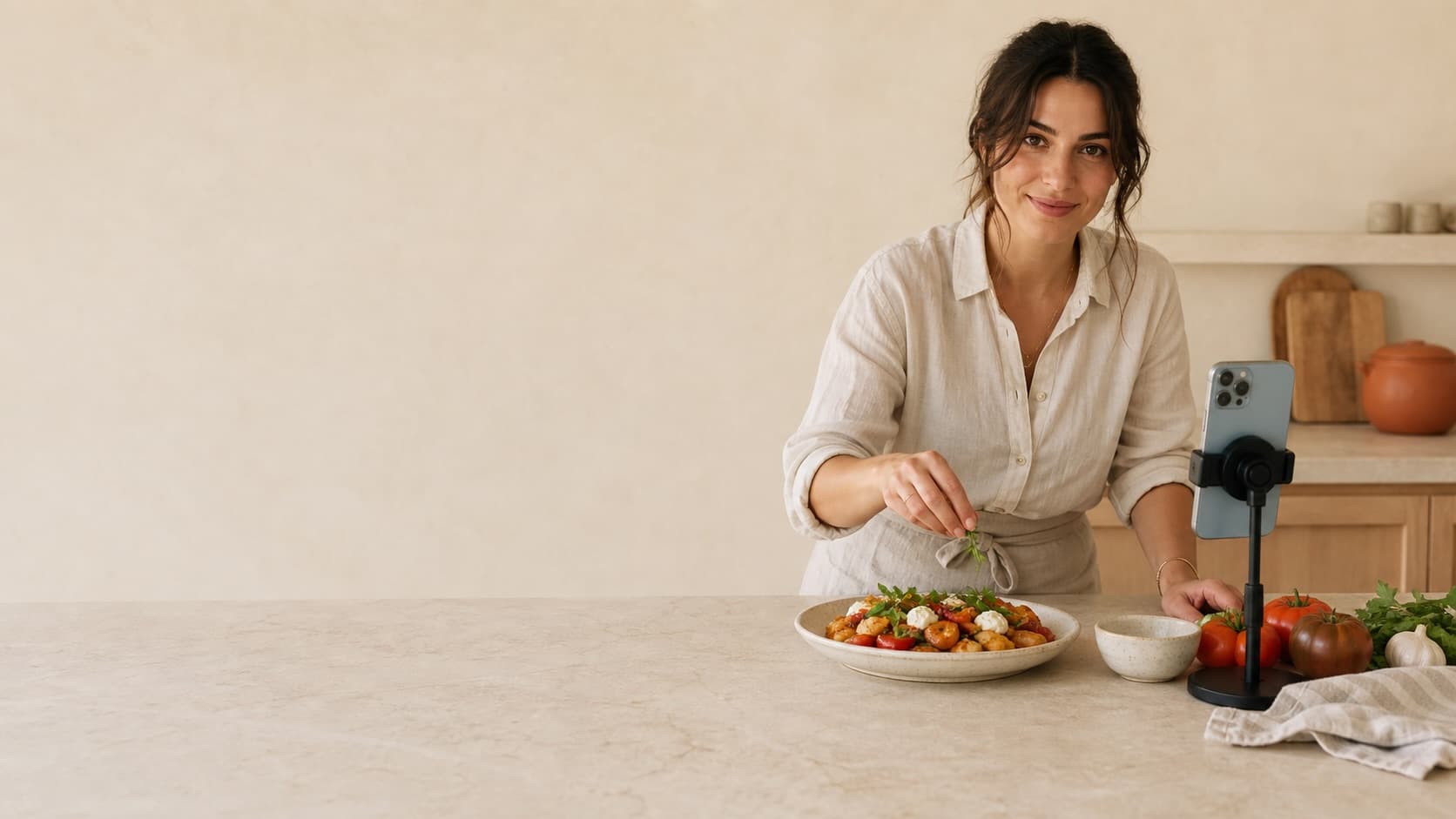Food creator presenting a finished dish to a phone camera